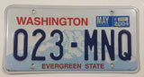 2004 Washington "Evergreen State" in Red on White and Blue Mountain Backdrop with Blue Letters Vehicle License Plate 023 MNQ
