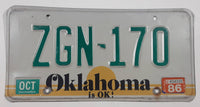 1986 Oklahoma is OK! Bright Yellow Sunset with Green Letters White Vehicle License Plate Tag ZGN 170
