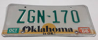 1986 Oklahoma is OK! Bright Yellow Sunset with Green Letters White Vehicle License Plate Tag ZGN 170