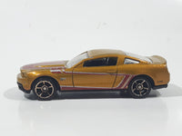 2011 Hot Wheels Faster Than Ever 2010 Ford Mustang GT Metalflake Gold Die Cast Toy Car Vehicle