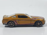 2011 Hot Wheels Faster Than Ever 2010 Ford Mustang GT Metalflake Gold Die Cast Toy Car Vehicle