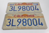 Matching Set of 2 1982-1989 California in Red with Yellow Sun, Stripes and The Golden State on White with Blue Letters Vehicle License Plate 3L98004