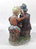 Vintage Old Man and Woman Couple Woman Whispering In His Ear Book and Teapot Set 7" Tall Figurine Sculpture
