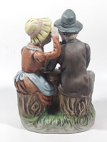 Vintage Old Man and Woman Couple Woman Whispering In His Ear Book and Teapot Set 7" Tall Figurine Sculpture