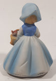 Vintage Girl and Blue and White Floral Dress Wearing a Bonnet and Holding a Basket 4 1/2" Tall Porcelain Figurine
