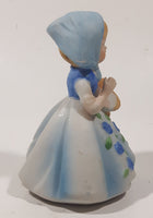 Vintage Girl and Blue and White Floral Dress Wearing a Bonnet and Holding a Basket 4 1/2" Tall Porcelain Figurine