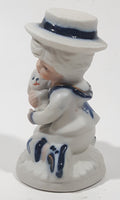 Vintage Brinns Blue and White French Colonial Boy Holding White Puppy Dog 4" Tall Porcelain Figurine