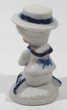 Vintage Brinns Blue and White French Colonial Boy Holding White Puppy Dog 4" Tall Porcelain Figurine