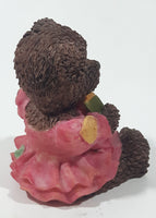 Dark Brown Teddy Bear Sitting In Pink Dress Holding Snake Formed As The Letter G 3 1/2" Tall Resin Figurine