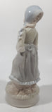 Vintage Sabre Fine Gifts Light Blue and Cream Woman in Bonnet Holding Flowers 8" Tall Ceramic Figurine