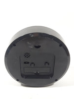 Black and White Round 5 1/4" Plastic Battery Operated Footed Desktop Alarm Clock