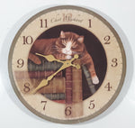 FirsTime Chat Mechant "Naughty Cat" Laying On Top Of A Stack Of Books 11 1/2" Round Wall Clock with Paper Hands
