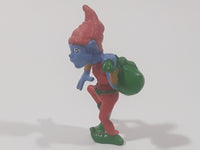 Blue Skinned Elf Wearing Red and Green Clothes Sneakily Carrying Bag While Walking On Tip Toes 2 1/2" Tall Toy Figure