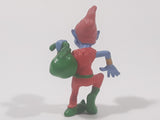 Blue Skinned Elf Wearing Red and Green Clothes Sneakily Carrying Bag While Walking On Tip Toes 2 1/2" Tall Toy Figure