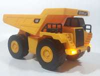 1997 Toy State CAT Caterpillar Dump Truck 9 1/4" Long Yellow Lights and Sound Plastic Toy Car Vehicle