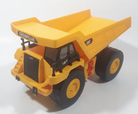 1997 Toy State CAT Caterpillar Dump Truck 9 1/4" Long Yellow Lights and Sound Plastic Toy Car Vehicle