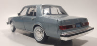 2011 Motor Max No. 73333 1986 Dodge Diplomat Metallic Light Blue 1/24 Scale 8 1/2" Long Die Cast Toy Car Vehicle with Opening Front Doors and Hood