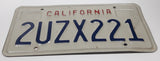 1990-95 California in Red on White with Blue Letters Vehicle License Plate 2UZX221