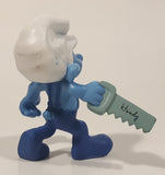 2011 Peyo "Carpenter" Smurf Holding a Saw with a Pencil in His Ear PVC Toy Figure McDonald's Happy Meal