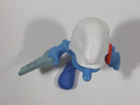 2011 Peyo "Carpenter" Smurf Holding a Saw with a Pencil in His Ear PVC Toy Figure McDonald's Happy Meal