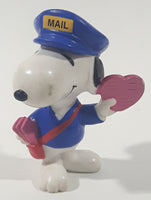 United Features Syndicate Peanuts Valentine's Day Mailman Snoopy Holding Pink Heart Shaped Letter 2 1/2" Tall PVC Toy Figure