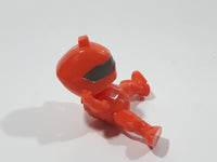 Orange Character with Helmet In Riding Pose With Arms Up 1 7/8" Tall Plastic Toy Figure