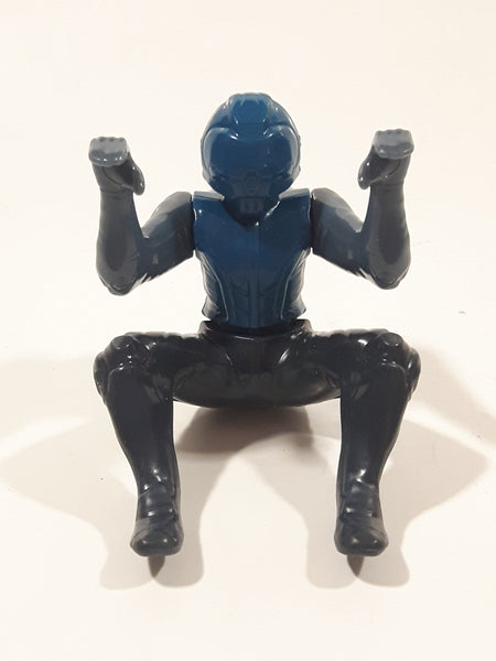 Blue and Grey Character with Helmet In Riding Pose With Arms Up 2 1/2" Tall Plastic Toy Figure