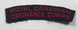 Royal Canadian Ordnance Corps 7/8" x 3 1/2" Arched Shoulder Title Fabric Patch Badge