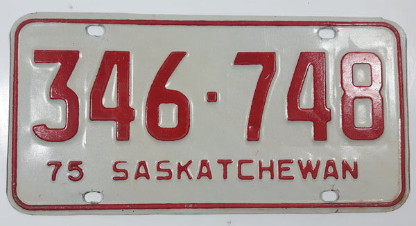 Vintage 1975 Saskatchewan Red Lettering White Vehicle License Plate Metal Tag 346 748