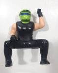 Black and Green Character with Helmet In Riding Pose 3 3/4" Tall Toy Figure