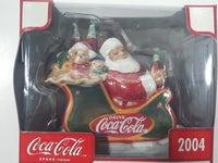 2004 Coca Cola Pearlescent Porcelain Ornament Collection Santa Claus in Sleigh Christmas Tree Ornament New in Box