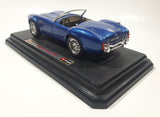 Burago 1965 Ford AC Cobra 427 Convertible Blue 1/24 Scale Die Cast Toy Car Vehicle with Opening Doors and Hood on Display Stand