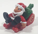 Santa Claus On His Sled with Bag of Presents 2 5/8" Long Toy Figure
