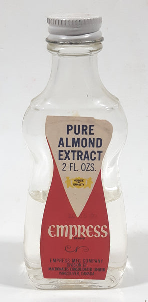 Vintage Empress Pure Almond Extract 2 FL Oz. 4 1/2" Tall Glass Spice Jar Half Full