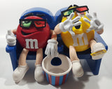 1999 M & M's Red And Yellow Character Sitting In Movie Theater Chairs Eating Popcorn Wearing 3D Glasses Plastic Candy Dispenser Machine