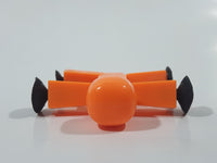 Orange 2 1/4" Tall Plastic Figure with Suction Cup Hands and Feet