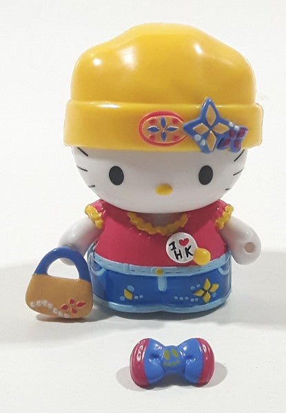 Rare 2003 Bandi Sanrio Hello Kitty Collection 1 7/8" Tall Toy Figure with Removable Snap On Clothes and Purse Basket Accessory and Hair Bow