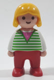 1990 Geobra Playmobil Girl with Blond Hair in White Shirt with Green Striped Sweater and Red Pants 2 1/4" Tall Toy Figure