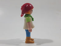 1992 Geobra Playmobil Girl with Blonde Hair Red Bonnet in White and Green Top and Blue Pants 2 1/8" Tall Toy Figure