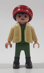 1992 Geobra Playmobil Boy with Black Hair Red Cap in Cream Vest and Green Top and Green Pants 2 1/8" Tall Toy Figure