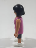 2010 Geobra Playmobil Woman with Black Hair Pink Tank Top and Dark Grey Capri Pants 3" Tall Toy Figure