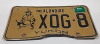 1989 Yukon The Klondike Man Panning Gold Themed Yellow Metal Vehicle License Plate Tag X0G 8