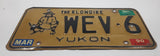 1989 1990 Yukon The Klondike Man Panning Gold Themed Yellow Metal Vehicle License Plate Tag WEV 6