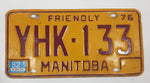 1976 Manitoba Yellow With Dark Red Letters Metal Vehicle License Plate Tag YHK 133