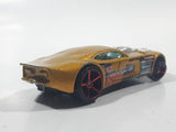 2007 Hot Wheels Nitro Doorslammer Aston Martin Metalflake Gold Die Cast Toy Car Vehicle