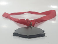 Canadian Outback Adventures Brass Medal Award with Red Ribbon