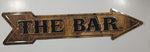 The Bar Wood Look Arrow Shaped 5 1/2" x 24" Embossed Tin Metal Sign